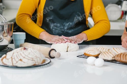 Preview: Hands Of Mexican Bakers Preparing Dough For Conchas Mexican Traditional Bread In Kitchen In Mexico