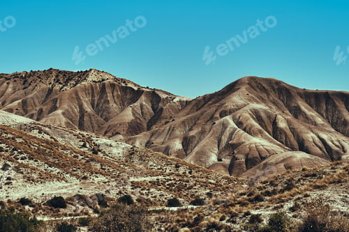 Preview: A Shot Of Mountains Under A Blue Sky