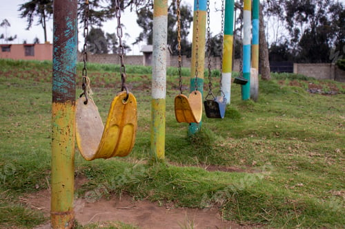 Preview: A Park With A Lot Of Old Weathered Chain Swings