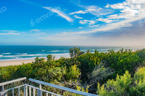 Preview: An Aerial Shot Of Green Beach Under Blue Sky