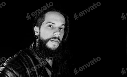 Preview: Studio Photography With Black Background Of A Hipster Style Man Wearing Leather Jacket.