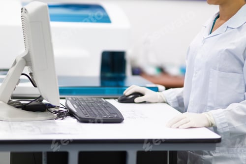 Preview: Female Nurse Working On Laptop Computer In Lab