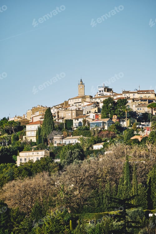 Preview: A Vertical Shot Of Buildings On The Hill Under A Blue Sky In Mougins, France