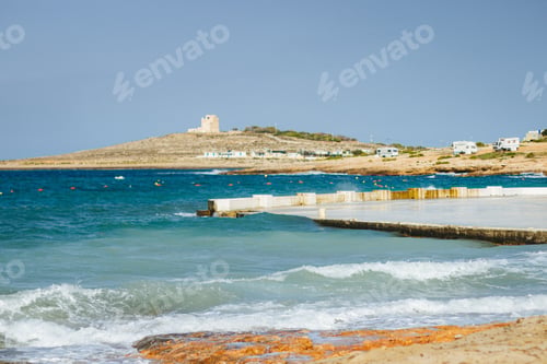 Preview: The Waters Of The Ocean Around The Beach Under The Blue Sky