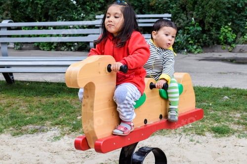 Preview: Little Latin Siblings On The Playground.