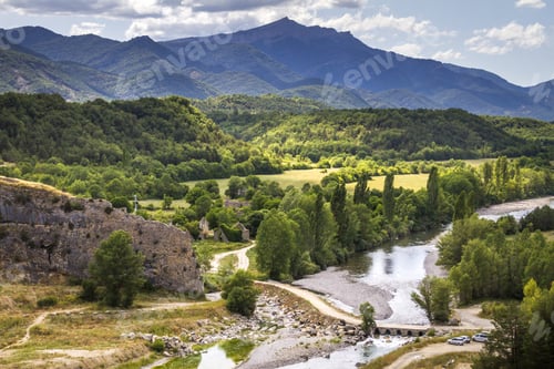Preview: A River Flowing Through Forested Mountains Covered By Dense Vegetation