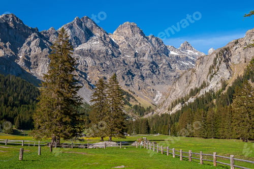 Preview: A Beautiful Mountainous Landscape With Greenery And Mountains In The Swiss Alps