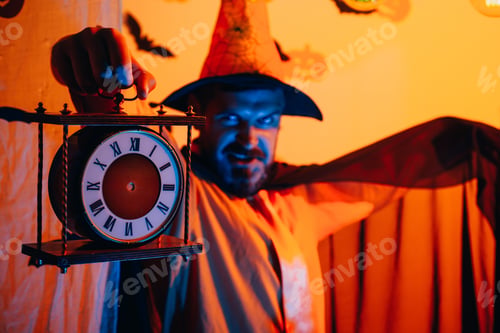 Preview: Magic, Enchantment And Witchcraft. Scary Face Man With Horror Make Up Holding Pumpkin Head Jack