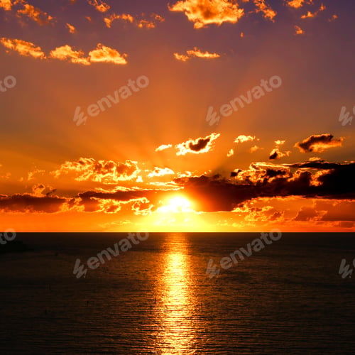 Preview: Vibrant Sunset Over The Ocean With Clouds And Sunbeams