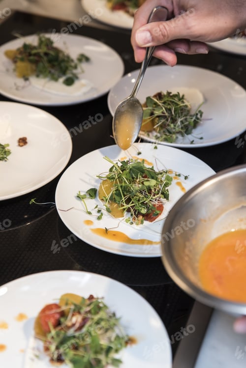 Preview: A Vertical Shot Of A Person'S Hand Holding A Spoon Over A Salad