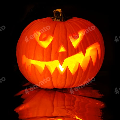 Preview: Single Spooky Halloween Jack O Lantern With Reflection On A Black Background