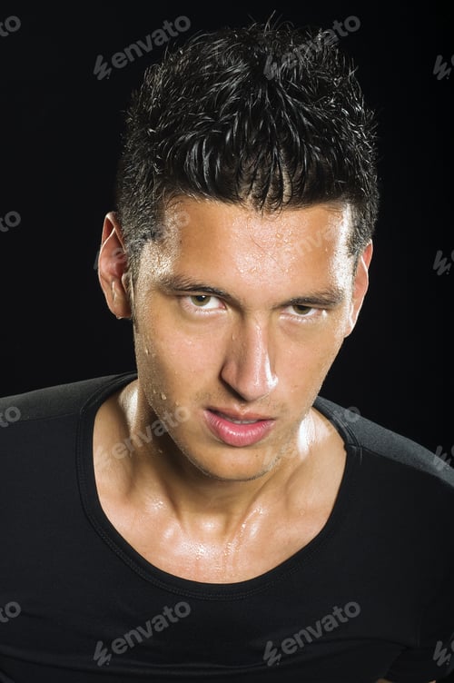 Preview: A Young Sweaty Soccer Player Sweating On A Low Key Setting.