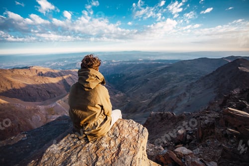 Preview: A Hiker Enjoying A Beautiful Landscape View From The Summit Of Mulhacen In Sierra Nevada, Spain