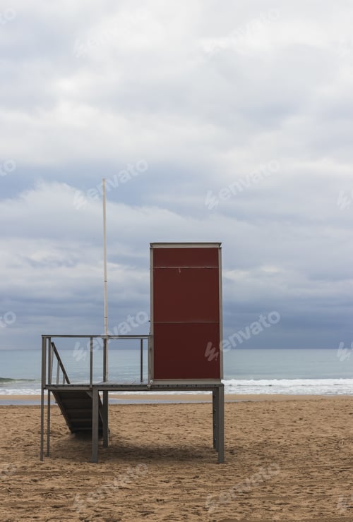 Preview: A Vertical Shot Of A Lifeguard Post On An Empty Beach