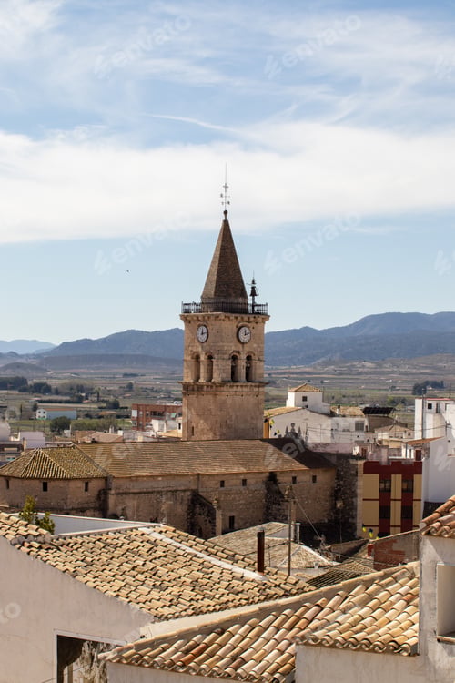 Preview: A Vertical Shot Of The Tower Bells And Big Clock Of Saint Santiago Church In Villena City