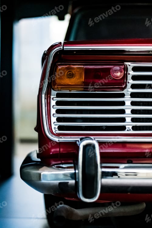 Preview: A Vertical Shot Of The Back Part Of A Vintage Classic Red Car