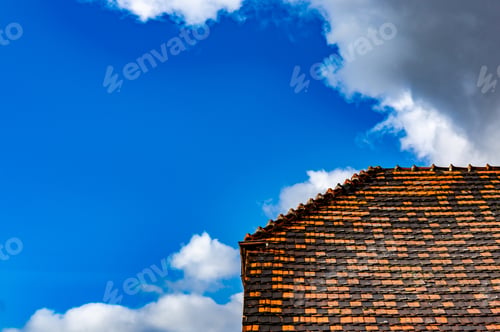 Preview: A Closeup Shot Of A Tiled Roof Detail Under A Cloudy Sky