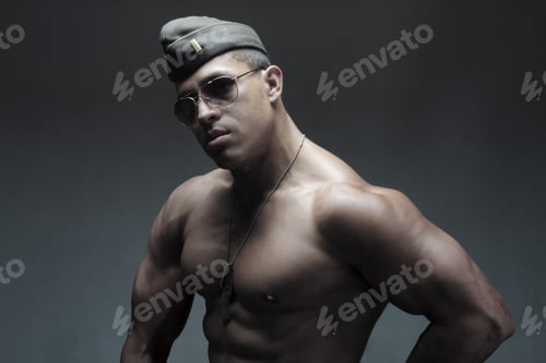 Preview: A Muscular Young Man In A Low Key Light With A Military Hat And Aviator Sunglasses.