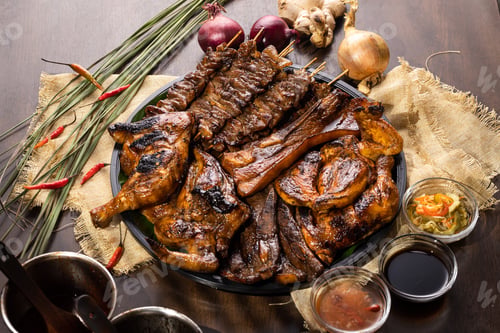 Preview: A Grilled Chicken Served With Delicious Pork And Kebab Together With Delicious Sauces And Garlic