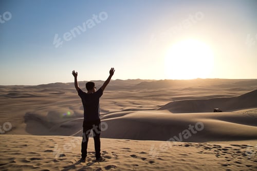 Preview: Young Man On Sand In A Desert Near Huacachina, Ica Region, Peru. The Sunset Desert View