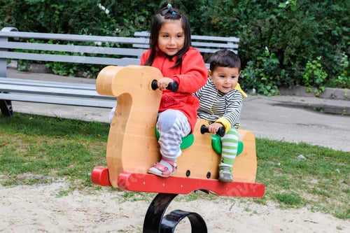 Preview: Little Latin Siblings On The Playground.