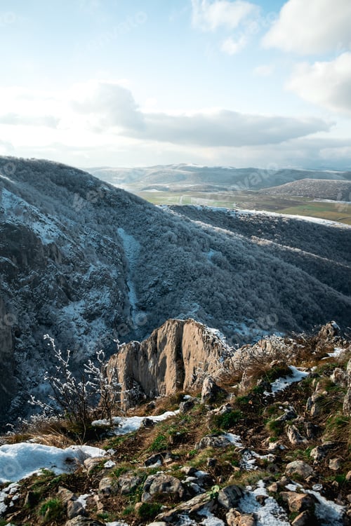 Preview: A High Angle Shot Of The High Hill Mountains Covered With Little Snow In The Daytime