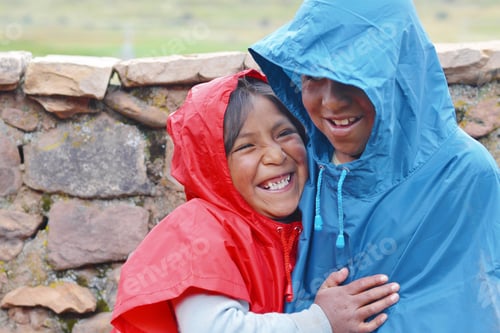 Preview: Happy Native American Kids Wearing Raincoat In The Countryside.