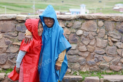 Preview: Happy Native American Kids Wearing Raincoat In The Countryside.