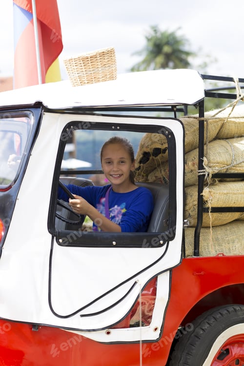 Preview: Portrait Of Happy Girl In Old Car Having Fun Outdoors