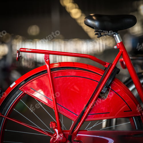 Preview: A Vertical Shot Of A Red Bicycle With A Blurred Background