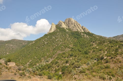 Preview: A Landscape View Of Green Hills