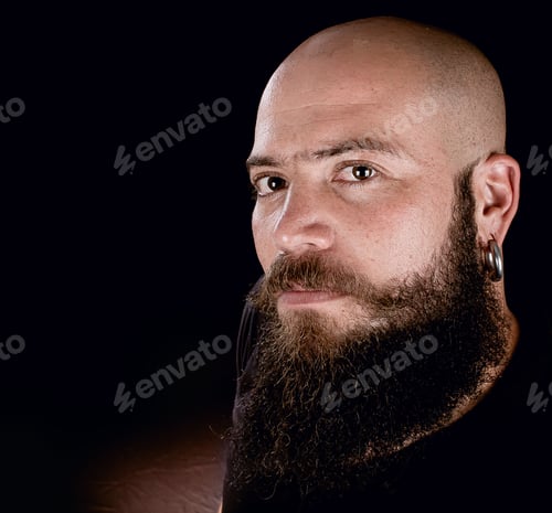 Preview: Photograph In Studio With Black Background Of A Hipster Style Man Looking At The Camera.