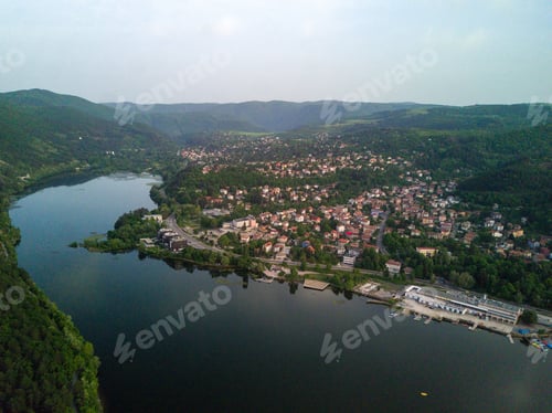 Preview: An Aerial Shot Of The Green Landscapes, Fields And A River Under The Cloudy Sky On A Sunny Day