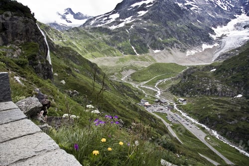 Preview: A Mesmerizing Scenery Of The Beautiful Snow-Capped Mountains Under A Cloudy Sky