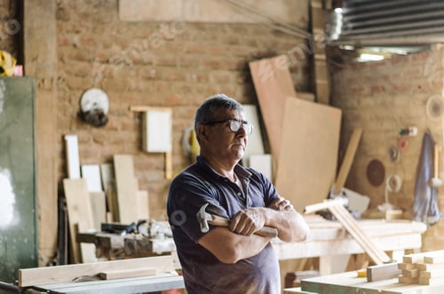 Preview: Portrait Of Senior Carpenter. Standing With The Background Of Your Carpentry Behind