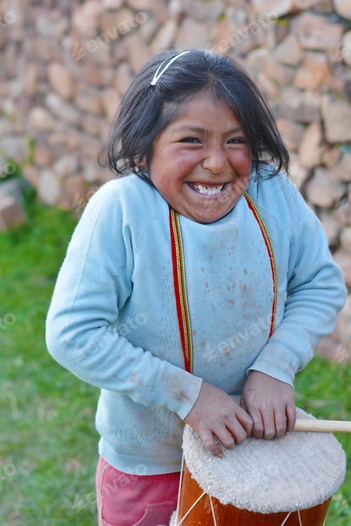 Preview: Little Native American Girl Playing Traditional Sikuri Drum.