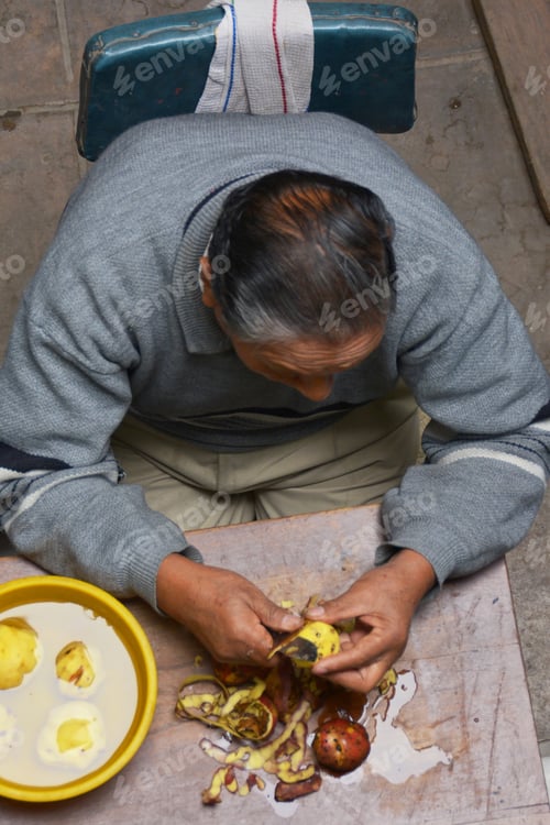 Preview: Old Latin Man Pealing Potato
