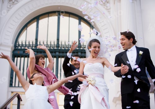 Preview: Low Angle View Of A Smiling Bride And Groom Descending Steps Outside The Church While The Wedding