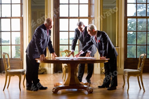 Preview: Senior Businessman Pointing Out Some Data In The Paperwork While Having A Meeting With His Senior