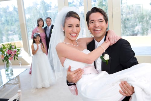 Preview: Horizontal Close-Up Shot Of A Groom Carrying The Bride In Arms At The Wedding With The Family