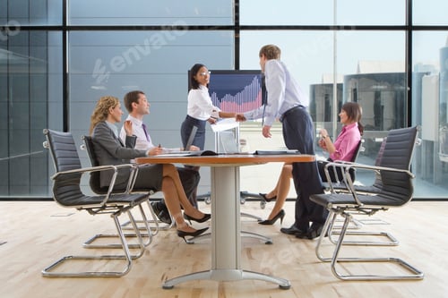 Preview: Confident Businesswoman Shaking Hands With Her Colleague After Giving A Successful Presentation.