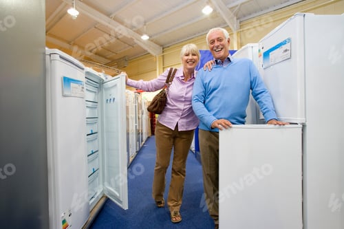 Preview: Senior Couple In An Electronics Appliances Store Checking Out New Refrigerators To Buy In The