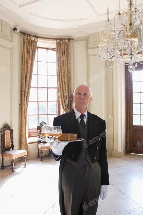 Preview: Butler Wearing A Tailcoat Standing With A Tray Containing Two Glasses Of Whiskey And A Box Of Cigars