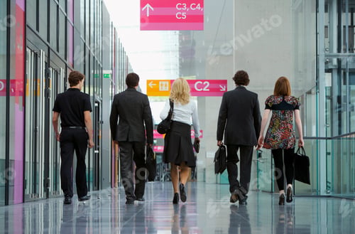 Preview: Rear View Of Businesspeople Walking To A Meeting At The Convention Center.