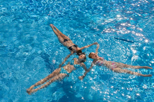 Preview: Group Of Teenage Girls Having Fun In The Swimming Pool On A Sunny Day.