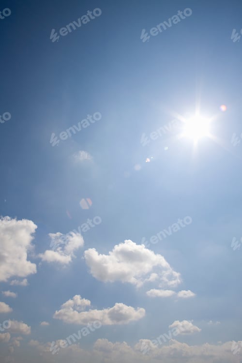 Preview: Vertical Shot Of Shining Sun At Cloudy Blue Sky With Copy Space.