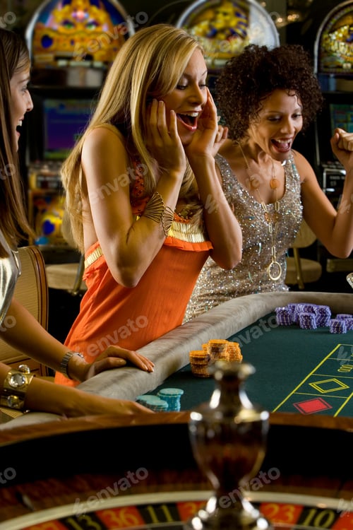 Preview: Young Women Gambling At The Roulette Table In The Casino And Celebrating Their Victory In The Game
