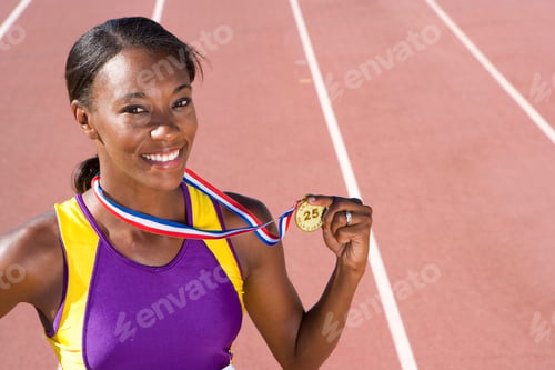 Preview: Young African Female Athlete Displaying Her Gold Medal After Winning A Race At An Athletics Event