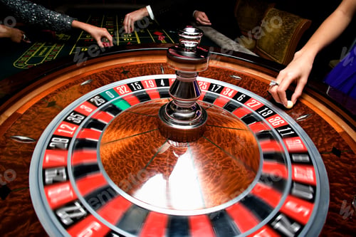 Preview: Selective Focus On The Roulette Table With The Group Of People Gambling In The Background.