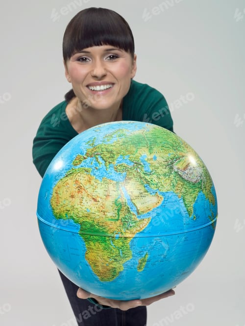 Preview: Young Woman In Her 20'S Is Holding Up A Globe In Her Outstretched Arms.